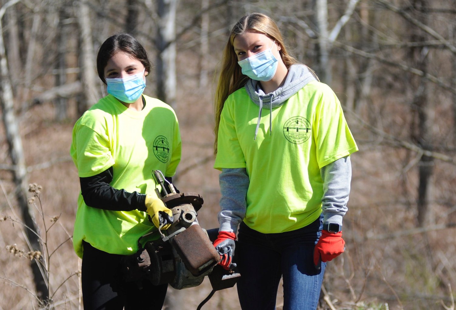 A heavy haul. Sullivan West students Georgeanne Cardon, a 15-year old sophomore and 13-yrear old freshman Abigail Parucki dragged an old oil burner motor out of the woods, Just for the record, county residents can get rid of scrap metal for free at the local transfer stations.